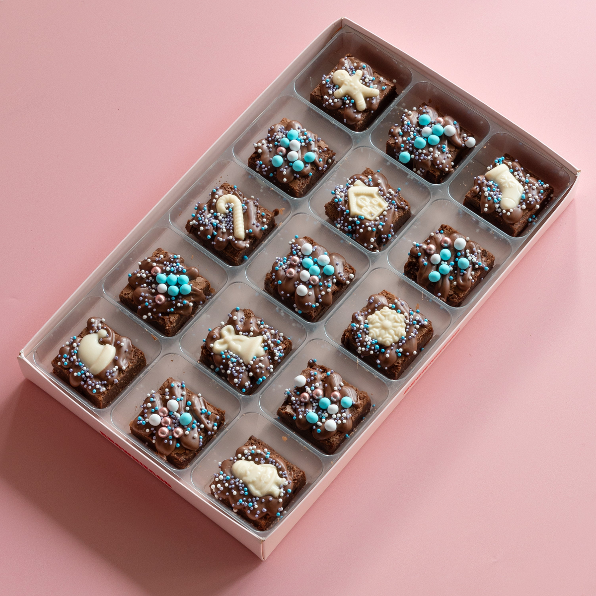 Box of 15 Christmas mini brownies with white chocolate star and candy cane toppers and blue and silver sprinkles