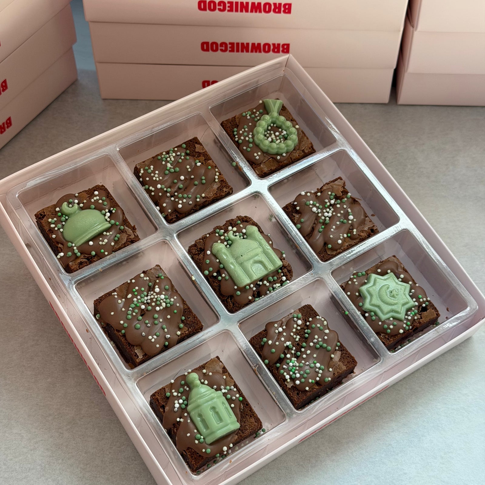 Box of nine Ramadan mini brownies topped with green chocolate mosque, lantern and star toppers